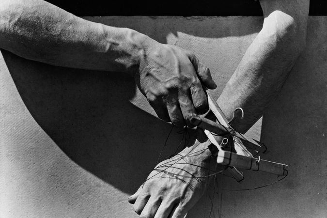 The hands of the puppeteer