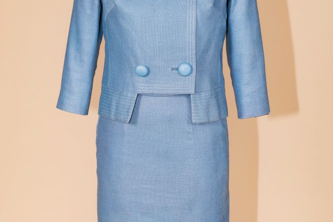 Four-button jacket and light blue linen skirt