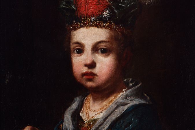Portrait of a boy with a feathered hat