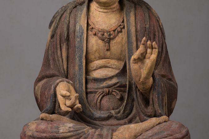 Bodhisattva assis en vitarkamudrā inversé