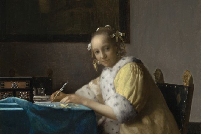 Woman writing in yellow