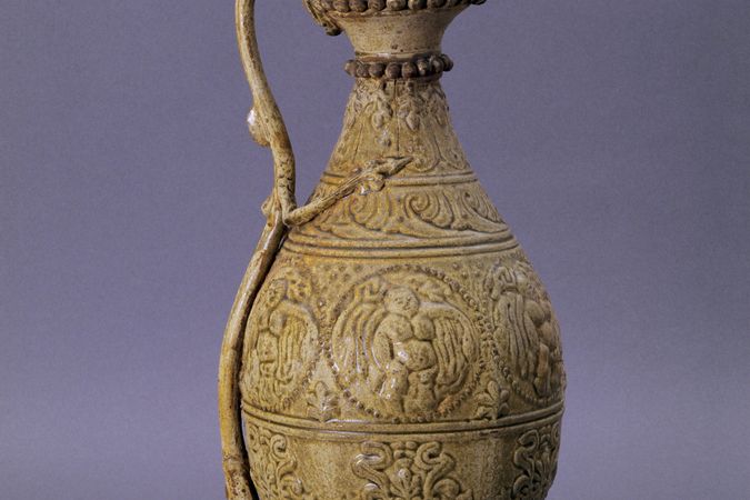 Pitcher with phoenix head lid