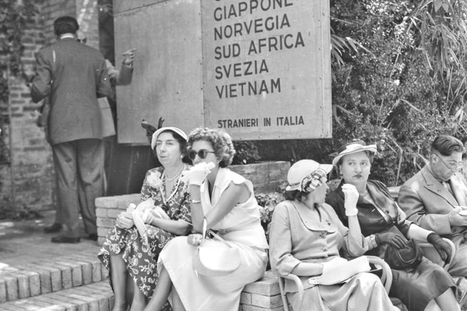 Interphoto, XXVI Venice Art Biennale, Women sitting at the entrance