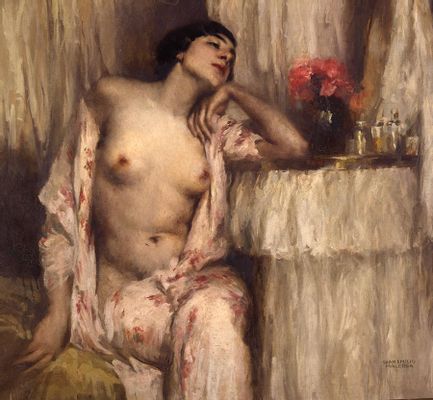 Half figure of a woman at the dressing table