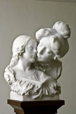 Mother kissing her daughter