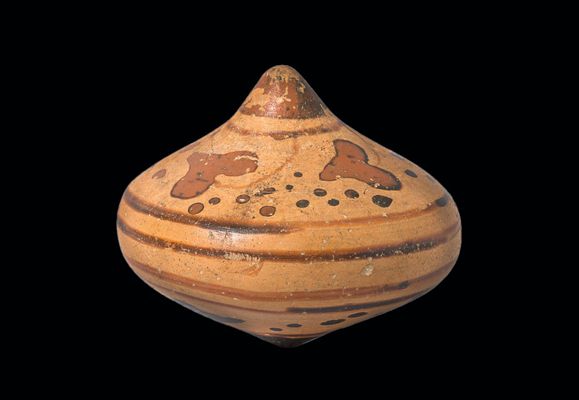 Peonza de cerámica etrusca figurada
