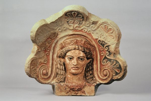 Terracotta architettonica (antefissa) a testa di menade del tempio del belvedere