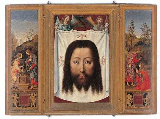 El rostro de Cristo entre dos ángeles