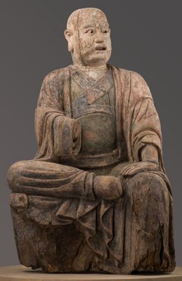 Luohan seated in ardhaparyaṅkāsana