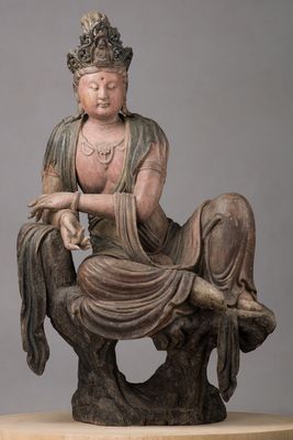 Bodhisattva Guanyin couché dans mahārājalīlāsana