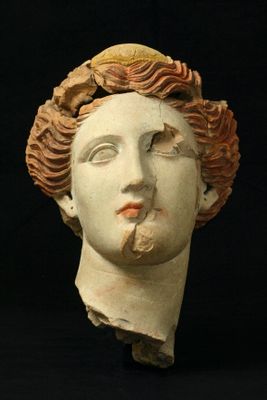 Female head in polychrome terracotta