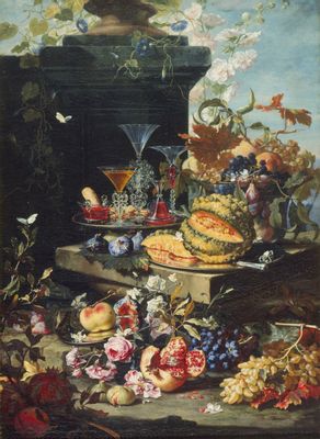 Flores, frutas y una bandeja con copas de cristal.