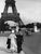 Couple with a sailor on the Eiffel Tower's deck